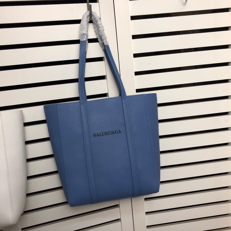 Front view of structured polished women's handbag – women's statement bag