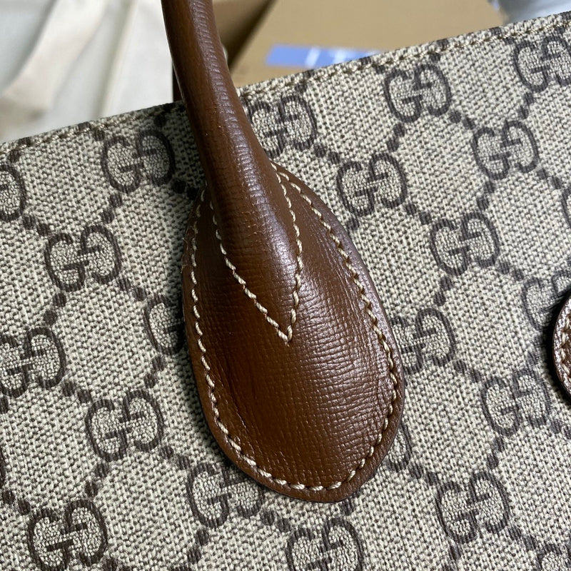 Handle and strap detail of signature polished women's handbag – women's designer-style accessory