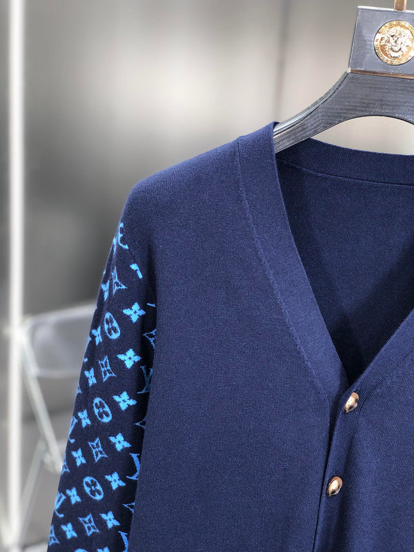 Close-up detail shot of Louis Vuitton luxury clothing with signature branding