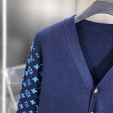 Close-up detail shot of Louis Vuitton luxury clothing with signature branding