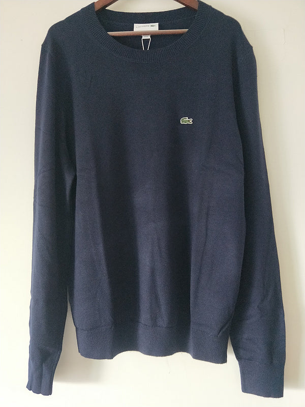 Back view of Lacoste luxury clothing with monogram-inspired silhouette