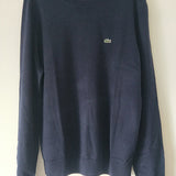 Back view of Lacoste luxury clothing with monogram-inspired silhouette