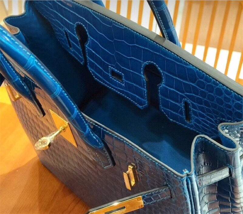Side view of streamlined structured handbag