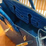 Side view of streamlined structured handbag