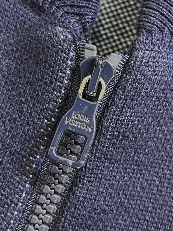 Flat lay presentation of Louis Vuitton luxury clothing with monogram-inspired silhouette