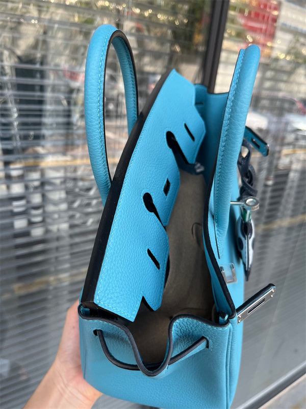 Side view of refined structured handbag