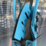 Side view of refined structured handbag