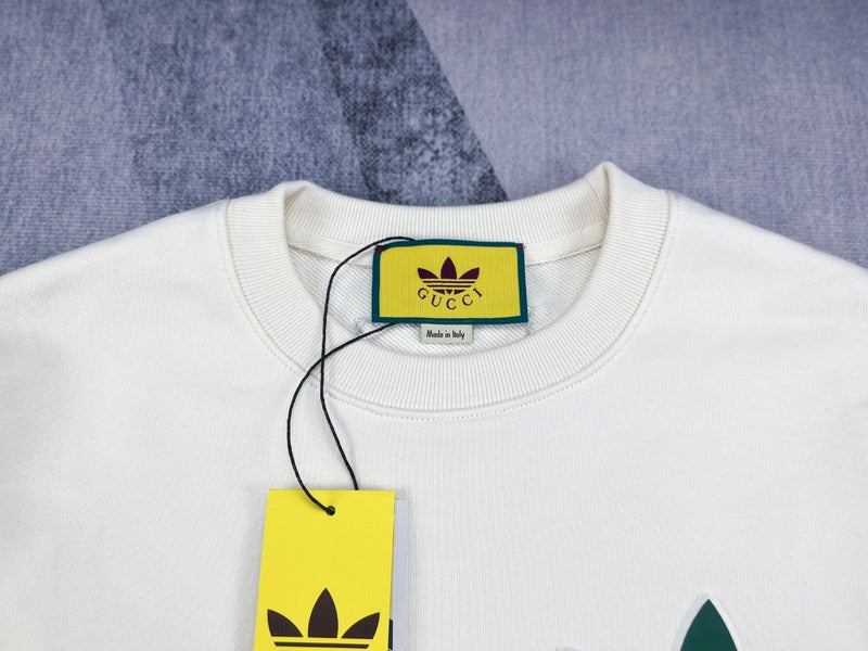 Close-up detail shot of Gucci luxury clothing with signature branding