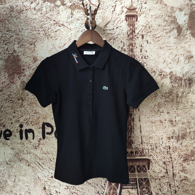 Close-up detail shot of Lacoste luxury clothing with signature branding