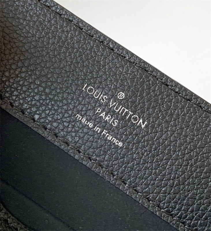  signature crossbody bag detail view showing craftsmanship