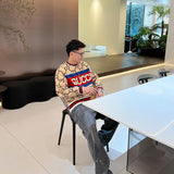 Front view of Gucci luxury clothing with logo-detail design