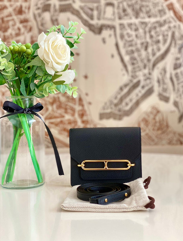 Side view of clean-lined structured handbag