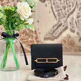 Side view of clean-lined structured handbag