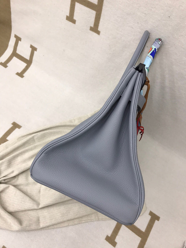 Side view of refined structured handbag