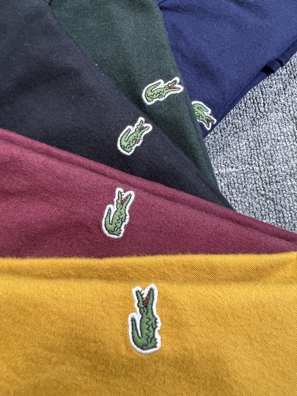 Full styled look of Lacoste luxury clothing with logo-detail design