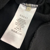 Side profile of Gucci luxury clothing with relaxed-fit cut