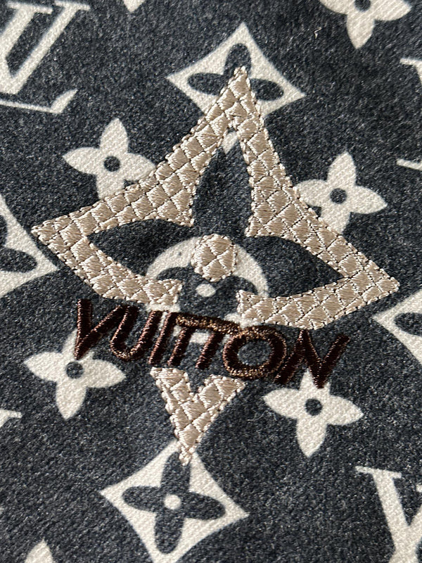 Flat lay presentation of Louis Vuitton luxury clothing with everyday silhouette