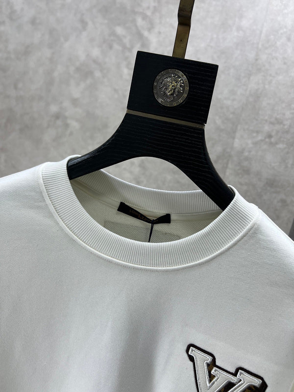 Full styled look of Louis Vuitton luxury clothing with logo-detail design