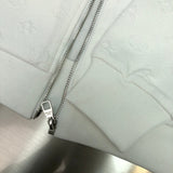 Front view of Louis Vuitton luxury clothing with monogram-inspired silhouette