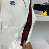 Side profile of Gucci luxury clothing with label-forward styling