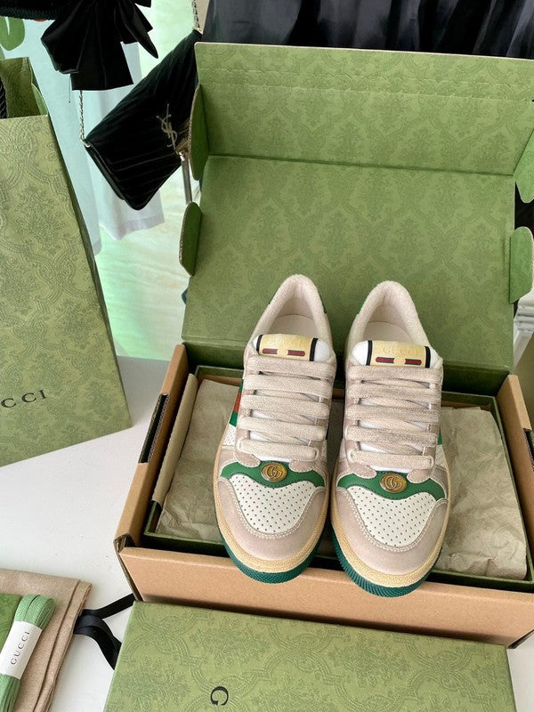 Side profile of Gucci neutral cream sneakers signature lace-up style