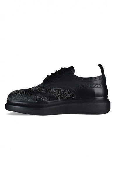 Alexander McQueen athletic side profile designer luxury fashion