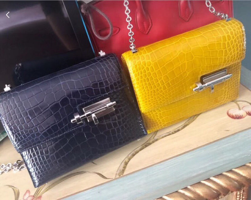 Side view of understated structured handbag