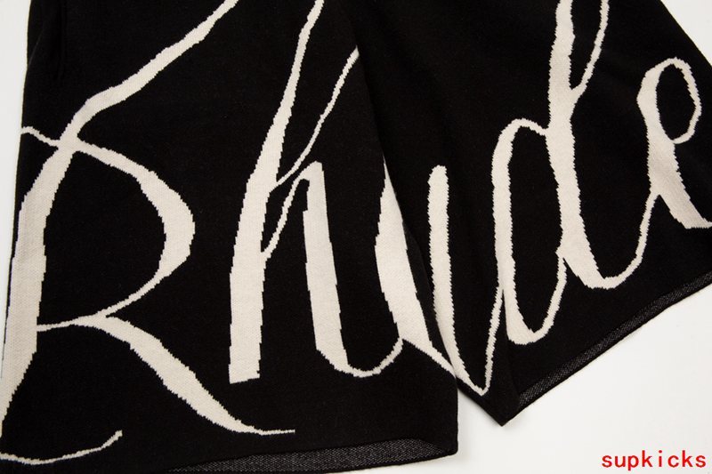 Close-up detail shot of Rhude luxury clothing with monogram-inspired silhouette