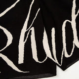 Close-up detail shot of Rhude luxury clothing with monogram-inspired silhouette