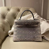  Structured top-handle bag carried on shoulder