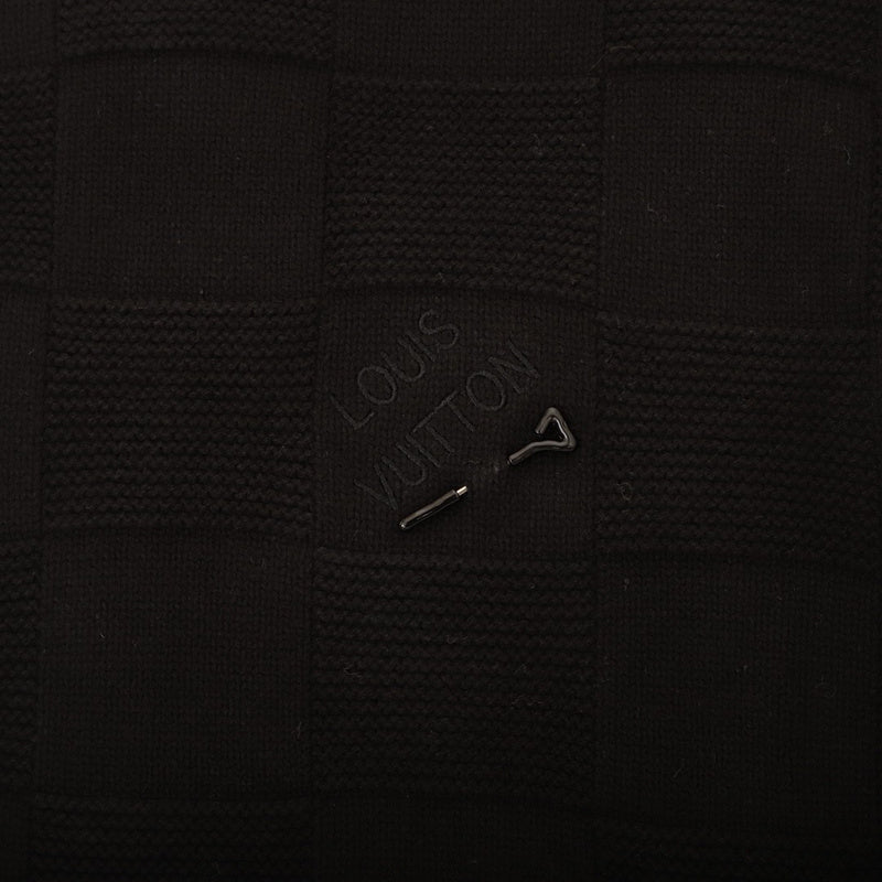 Flat lay presentation of Louis Vuitton luxury clothing with logo-detail design