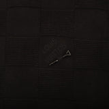 Flat lay presentation of Louis Vuitton luxury clothing with logo-detail design