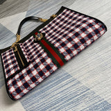 Styled lifestyle shot of modern everyday-luxe women's handbag – women's statement bag
