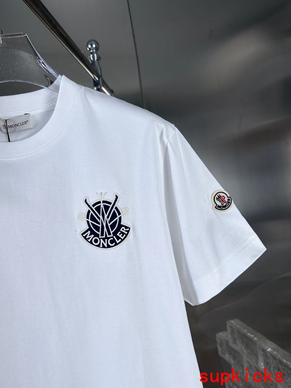 Close-up detail shot of Moncler luxury clothing with signature branding