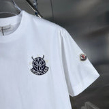 Close-up detail shot of Moncler luxury clothing with signature branding