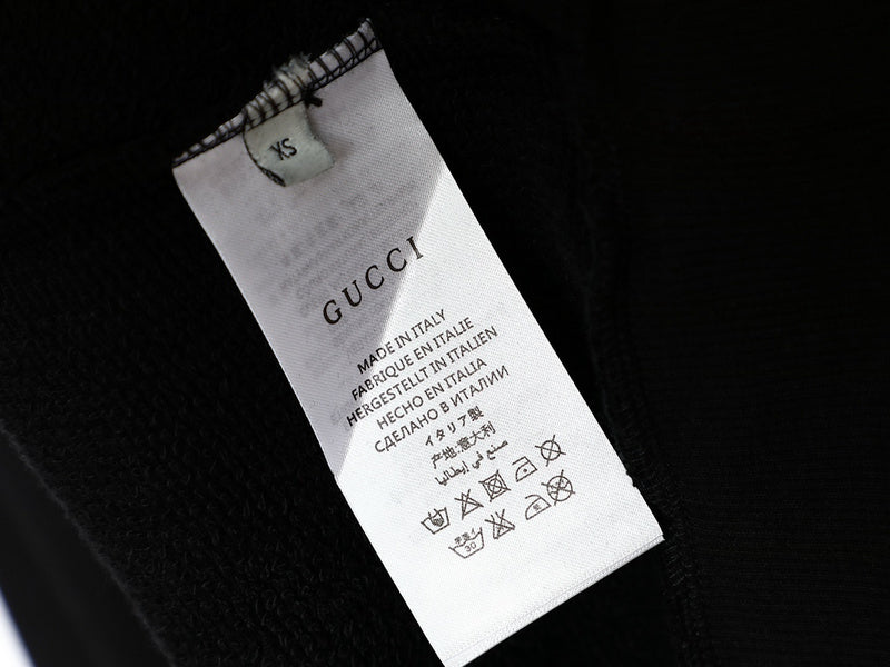 Close-up detail shot of Gucci luxury clothing with tailored silhouette