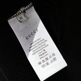 Close-up detail shot of Gucci luxury clothing with tailored silhouette