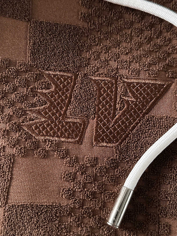 Flat lay presentation of Louis Vuitton luxury clothing with everyday silhouette