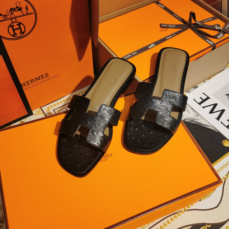 Hermès Tan Slide Sandals - Angled View