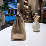 Side view of streamlined structured handbag
