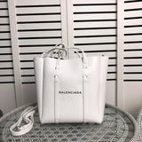 Side profile of modern refined women's handbag – women's statement bag