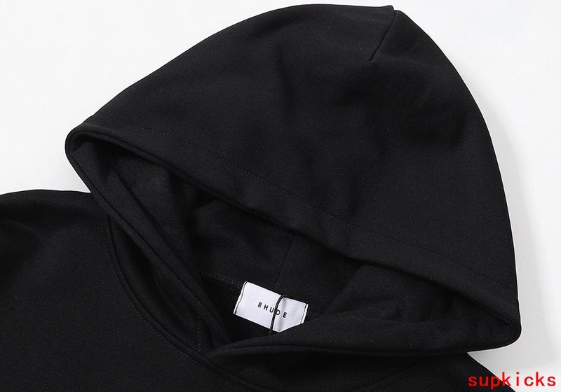 Close-up detail shot of Rhude luxury clothing with signature branding