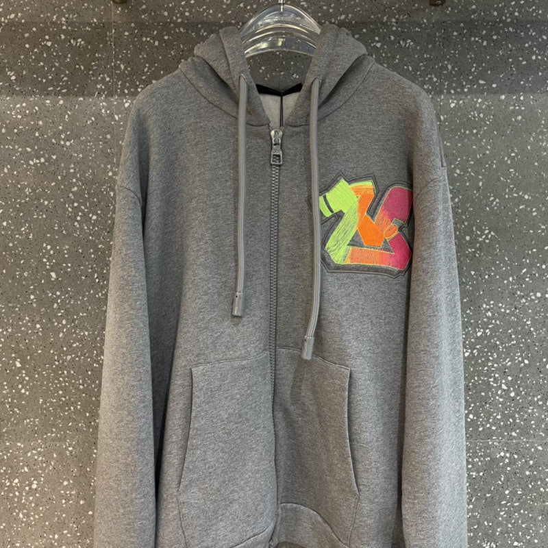 Side profile of Louis Vuitton luxury clothing with label-forward styling
