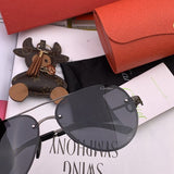 Side view of Cartier unisex sunglasses