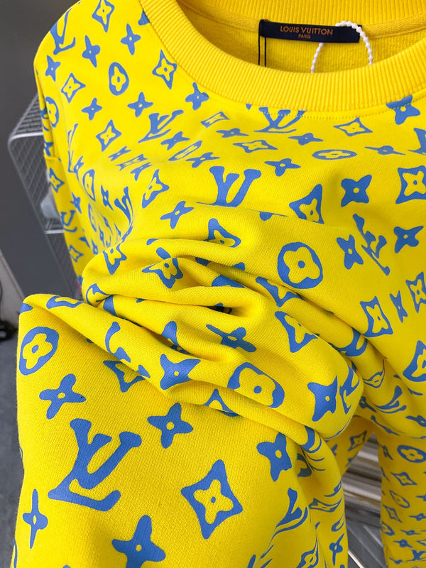 Flat lay presentation of Louis Vuitton luxury clothing with everyday silhouette