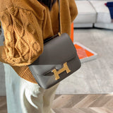 Side view of streamlined structured handbag