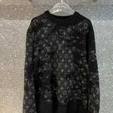 Back view of Louis Vuitton luxury clothing with label-forward styling