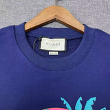 Side profile of Gucci luxury clothing with signature branding