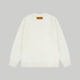 Close-up detail shot of Louis Vuitton luxury clothing with relaxed-fit cut