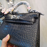 Side view of modern structured handbag